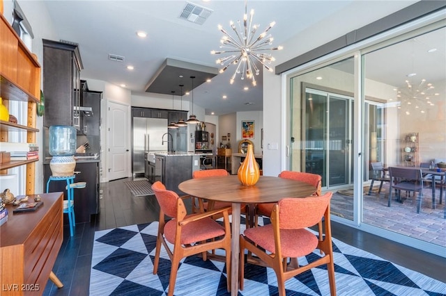 125 Mirage View Dr, Henderson, NV 89011 - dining room featuring a chandelier, dark wood-style flooring, and recessed lighting