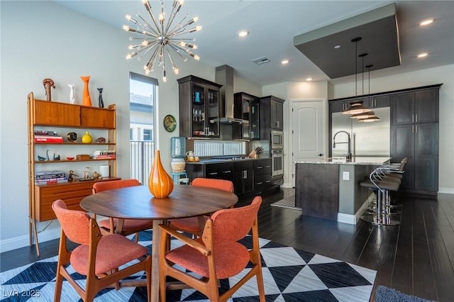 125 Mirage View Dr, Henderson, NV 89011 - dining space featuring a chandelier, baseboards, dark wood finished floors, and recessed lighting