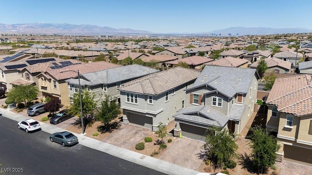 aerial perspective of suburban area with a mountainous background
