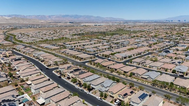 aerial view of property's location featuring mountains and nearby suburban area
