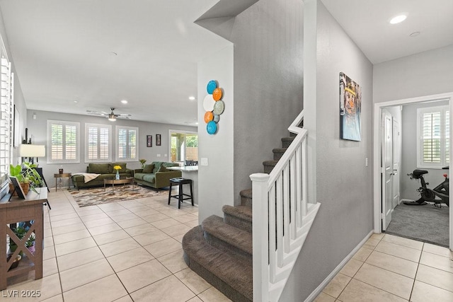 staircase featuring tile patterned flooring, plenty of natural light, recessed lighting, and ceiling fan