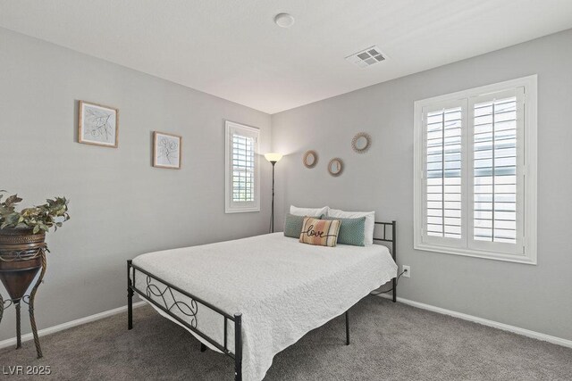 bedroom with carpet floors and baseboards