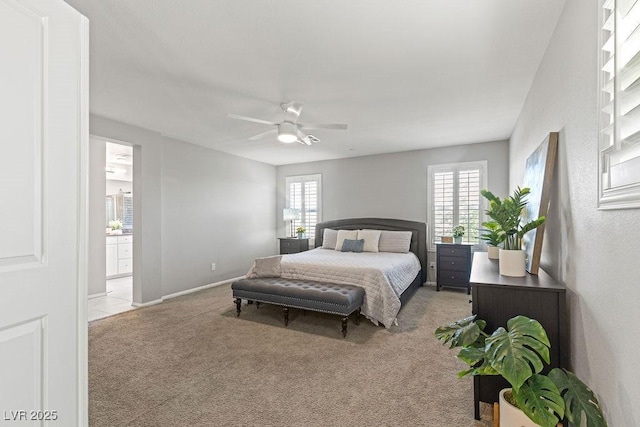 bedroom featuring light carpet, multiple windows, baseboards, and ceiling fan