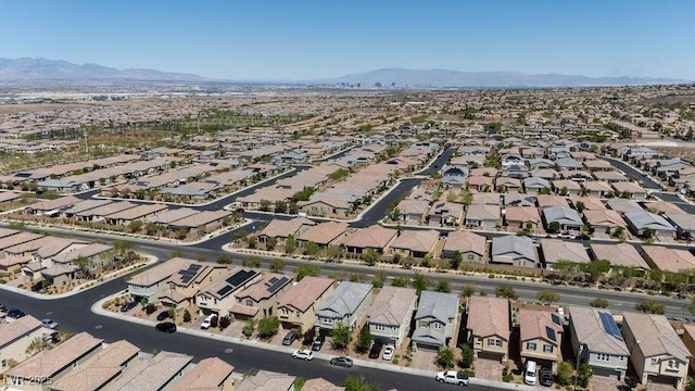 aerial overview of property's location with nearby suburban area and a mountain backdrop