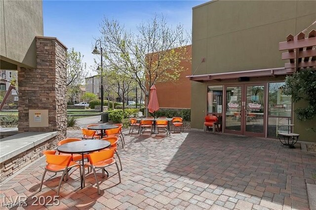 view of patio / terrace featuring french doors and outdoor dining space