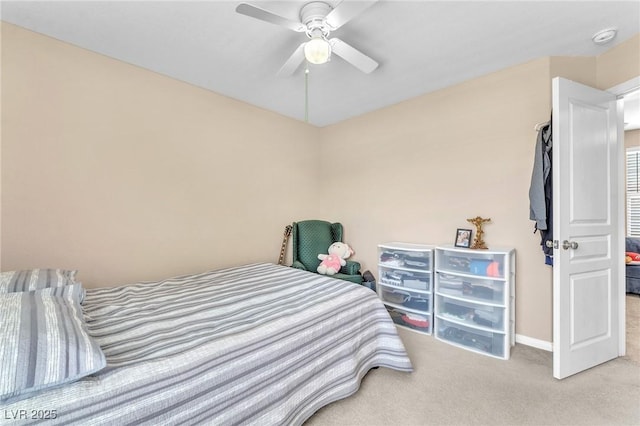 7115 Hickory Post Ave, Las Vegas, NV 89179 - carpeted bedroom featuring a ceiling fan and baseboards