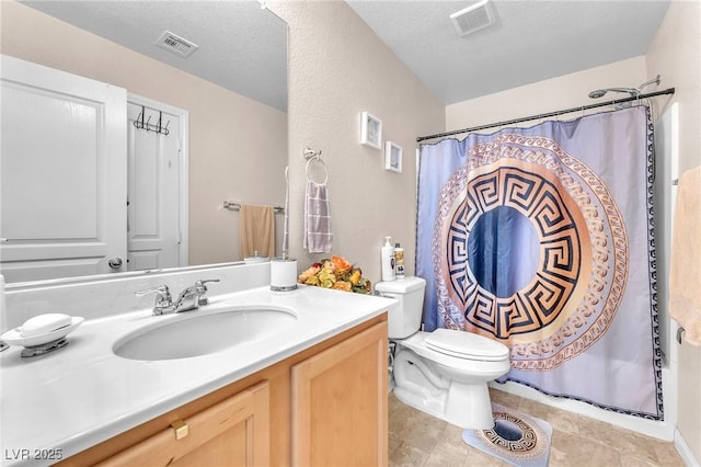 7115 Hickory Post Ave, Las Vegas, NV 89179 - full bath featuring toilet, vanity, a shower with curtain, a textured ceiling, and tile patterned flooring