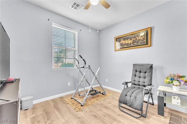 7115 Hickory Post Ave, Las Vegas, NV 89179 - workout room featuring ceiling fan, light wood-style floors, and baseboards