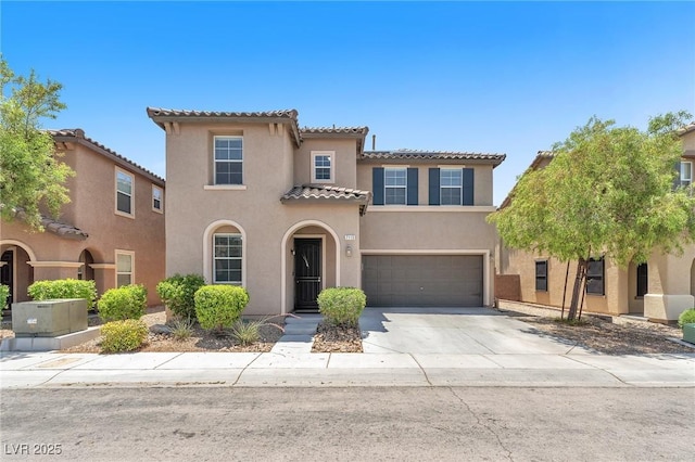 7115 Hickory Post Ave, Las Vegas, NV 89179 - mediterranean / spanish-style home featuring stucco siding, a tiled roof, concrete driveway, and an attached garage