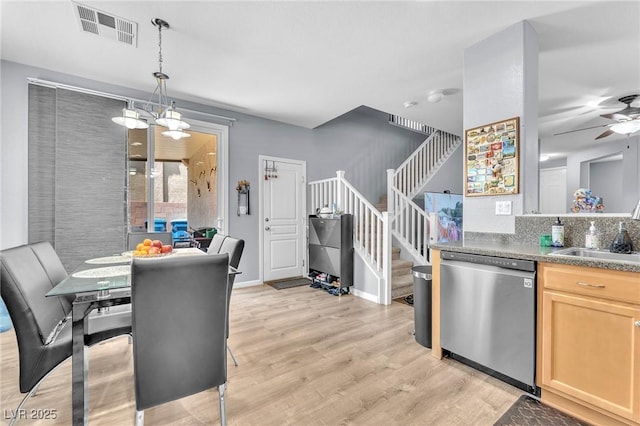 7115 Hickory Post Ave, Las Vegas, NV 89179 - dining space featuring stairs, light wood-style floors, and a ceiling fan