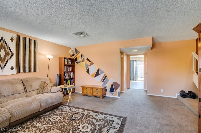 living room with a textured ceiling, carpet flooring, and baseboards