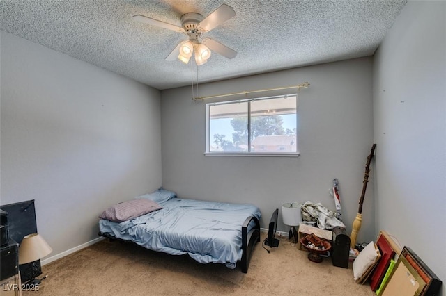 carpeted bedroom with a textured ceiling and a ceiling fan