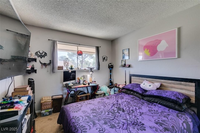 bedroom with carpet and a textured ceiling