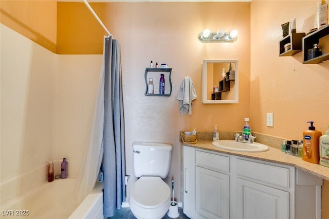 bathroom featuring vanity, toilet, and shower / bath combo with shower curtain