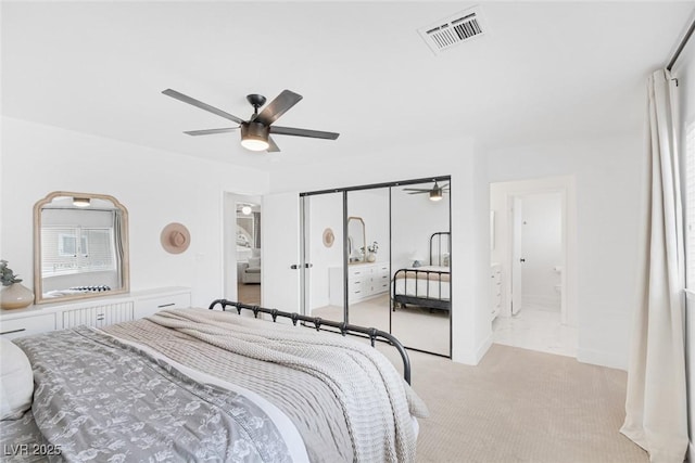 325 Heather Dr, Henderson, NV 89002 - bedroom featuring light colored carpet, ceiling fan, and ensuite bath