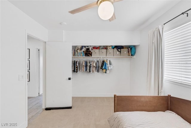 325 Heather Dr, Henderson, NV 89002 - carpeted bedroom featuring multiple windows and ceiling fan