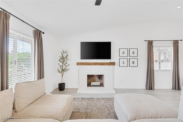325 Heather Dr, Henderson, NV 89002 - living area with vaulted ceiling, healthy amount of natural light, and a fireplace