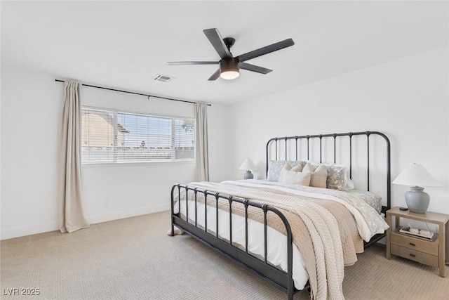 325 Heather Dr, Henderson, NV 89002 - bedroom featuring light carpet, baseboards, and a ceiling fan