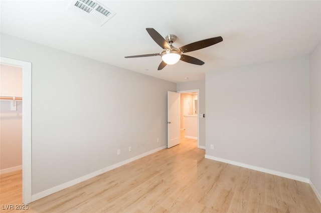 6145 May River St, Las Vegas, NV 89148 - empty room with light wood finished floors, a ceiling fan, and baseboards