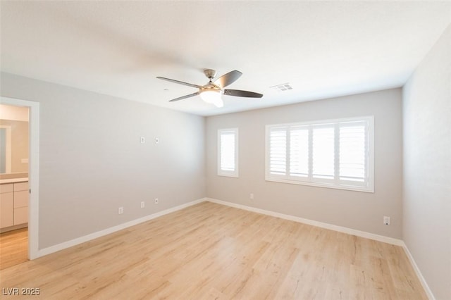 6145 May River St, Las Vegas, NV 89148 - unfurnished room with light wood-style flooring, a ceiling fan, and baseboards