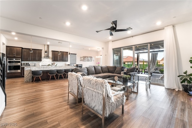 212 Harris Peak St, Las Vegas, NV 89138 - living room featuring wood finished floors, a ceiling fan, and recessed lighting