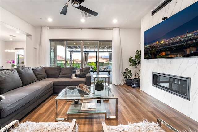 212 Harris Peak St, Las Vegas, NV 89138 - living area featuring a premium fireplace, ceiling fan, wood finished floors, and recessed lighting