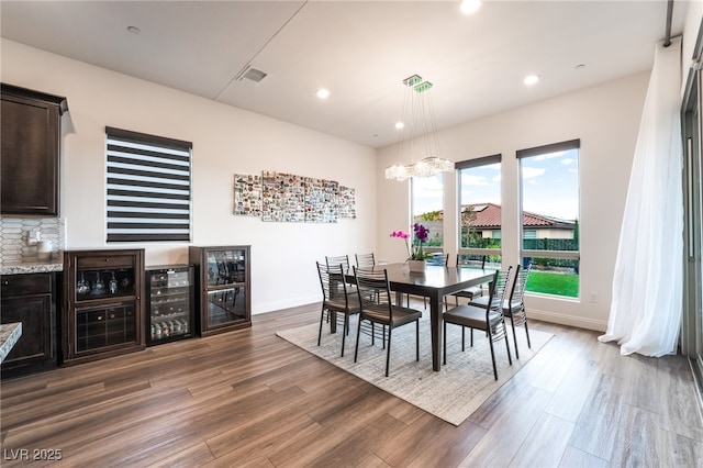 212 Harris Peak St, Las Vegas, NV 89138 - dining space with wine cooler, dark wood-style floors, and recessed lighting