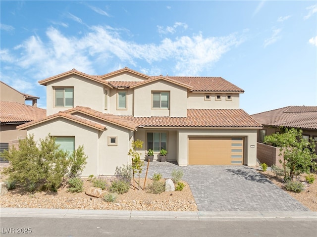 212 Harris Peak St, Las Vegas, NV 89138 - mediterranean / spanish-style house featuring stucco siding, decorative driveway, a tile roof, and a garage