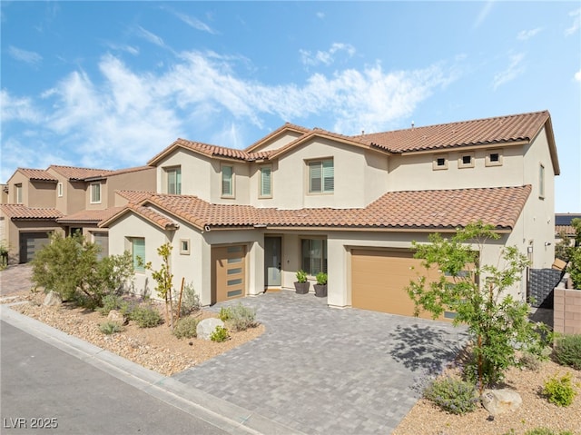 212 Harris Peak St, Las Vegas, NV 89138 - view of front facade with stucco siding, a garage, decorative driveway, and a tiled roof