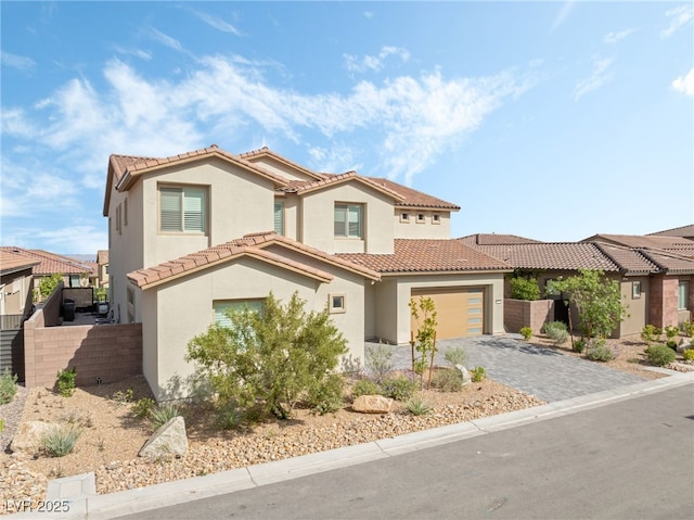 212 Harris Peak St, Las Vegas, NV 89138 - mediterranean / spanish house with stucco siding, decorative driveway, and a tile roof