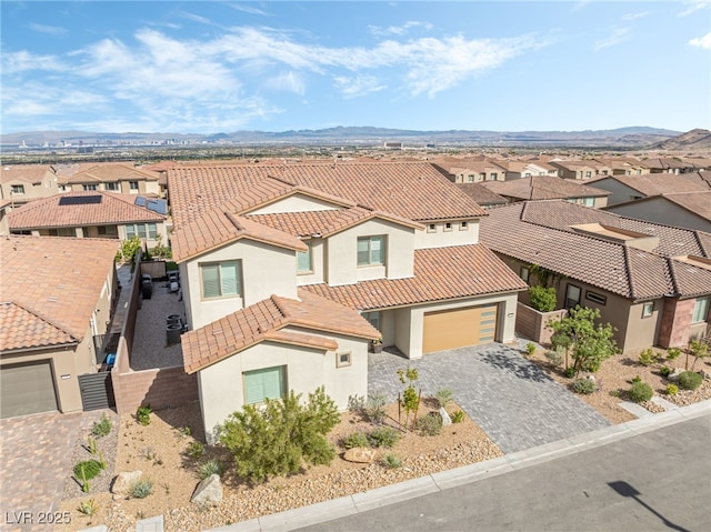 212 Harris Peak St, Las Vegas, NV 89138 - view of front of house featuring stucco siding, a tile roof, a residential view, and driveway
