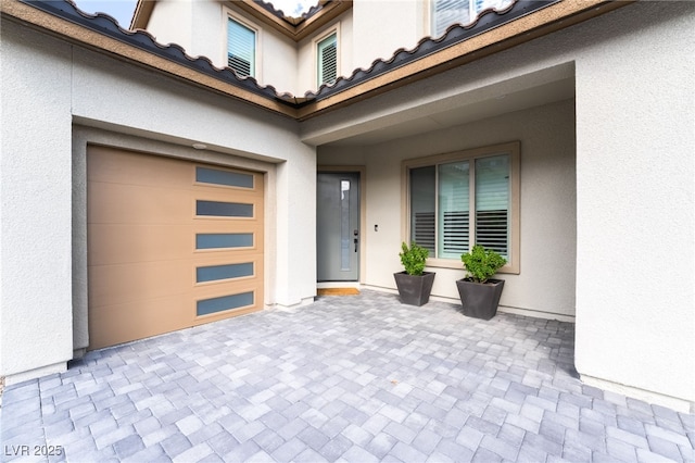 212 Harris Peak St, Las Vegas, NV 89138 - entrance to property featuring stucco siding, driveway, and a patio area