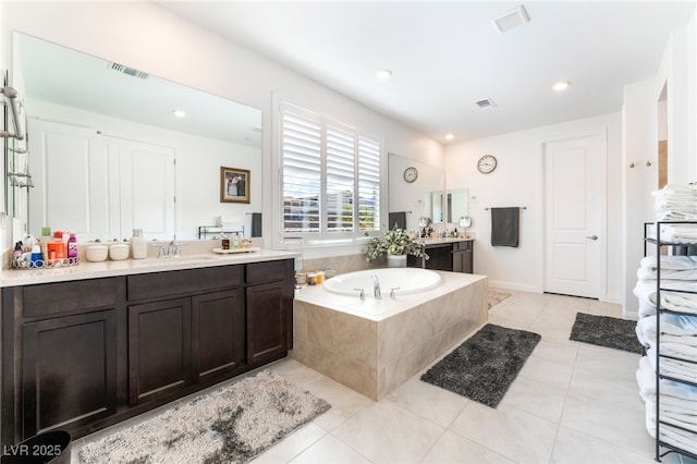 212 Harris Peak St, Las Vegas, NV 89138 - full bathroom with two vanities, a bath, tile patterned flooring, and recessed lighting