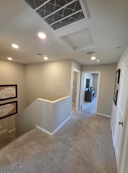 hallway featuring an upstairs landing, carpet, attic access, recessed lighting, and baseboards