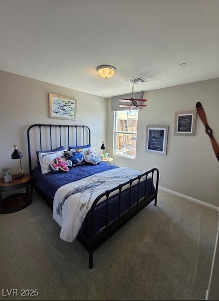 bedroom with carpet and baseboards