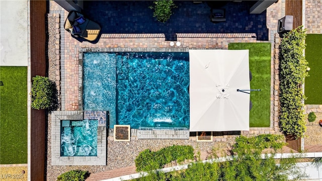 drone / aerial view of a pool area