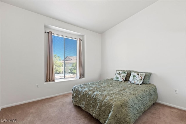 bedroom with carpet and baseboards