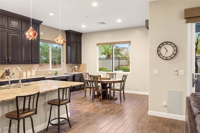 2116 Canvas Edge Dr, Henderson, NV 89044 - kitchen with a sink, baseboards, healthy amount of natural light, and recessed lighting