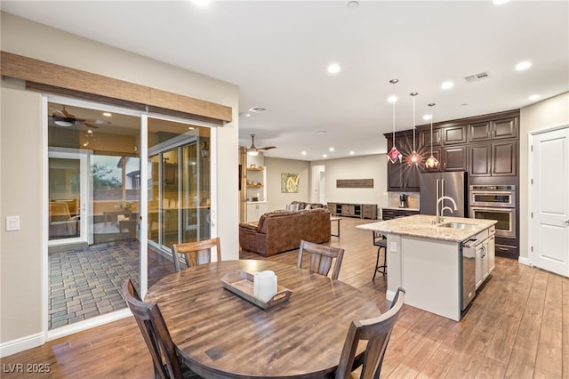 2116 Canvas Edge Dr, Henderson, NV 89044 - dining room featuring a ceiling fan, light wood finished floors, and recessed lighting