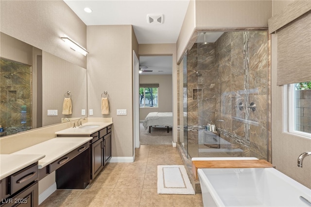 2116 Canvas Edge Dr, Henderson, NV 89044 - bathroom featuring a stall shower, healthy amount of natural light, vanity, and ceiling fan