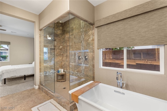 2116 Canvas Edge Dr, Henderson, NV 89044 - ensuite bathroom with a shower stall, a freestanding tub, and tile patterned flooring