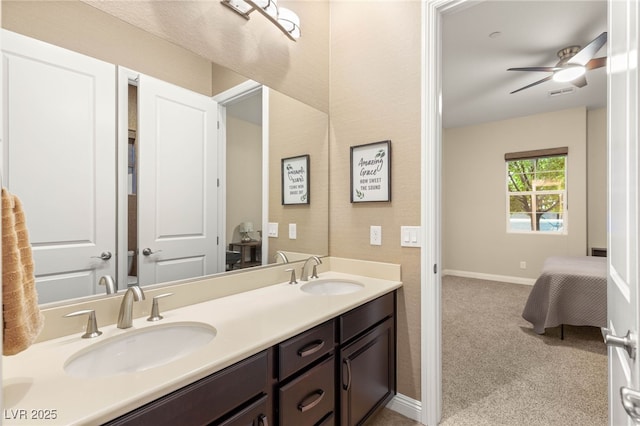 2116 Canvas Edge Dr, Henderson, NV 89044 - full bath featuring double vanity, a ceiling fan, and baseboards