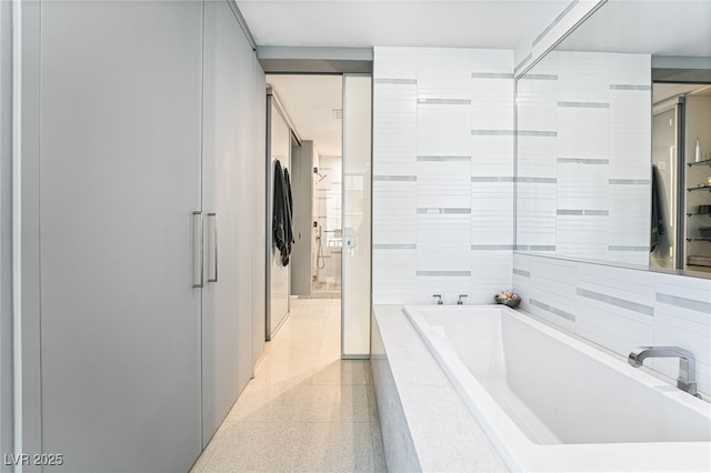 3726 Las Vegas Blvd Unit 2410, Las Vegas, NV 89158 - bathroom with tiled bath and speckle patterned floor
