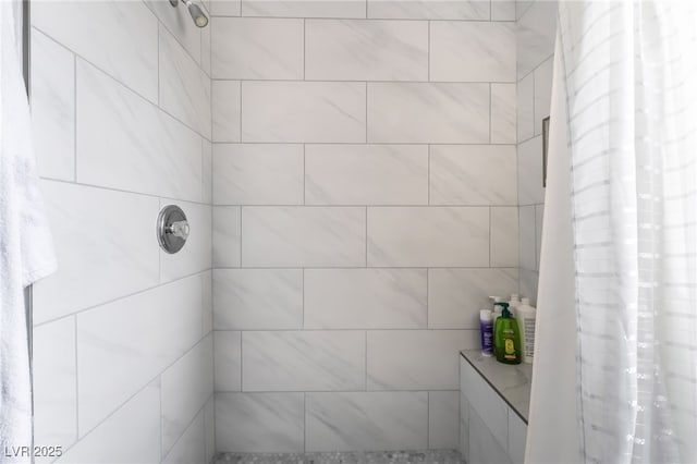full bathroom with a tile shower