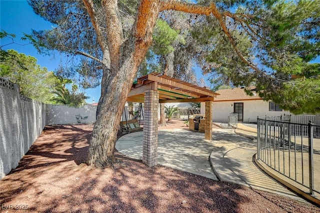 view of patio with a pergola and a fenced backyard