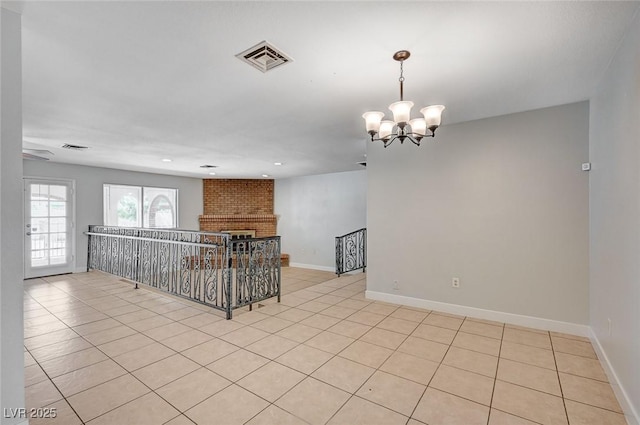 spare room with light tile patterned floors, a chandelier, baseboards, and recessed lighting