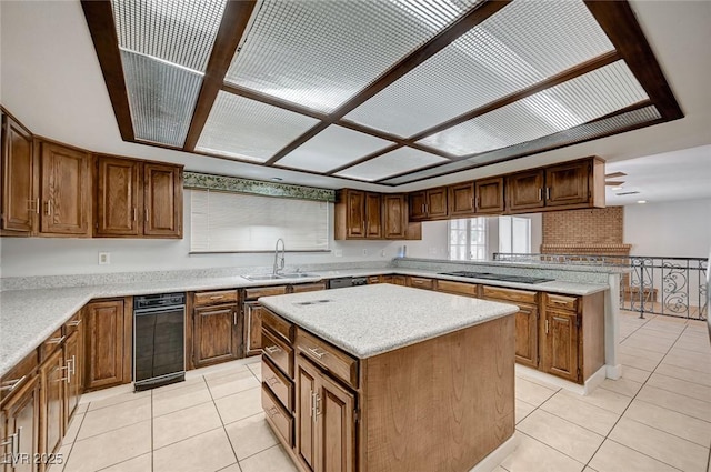 kitchen with a sink, light tile patterned floors, a center island, black stovetop, and a peninsula