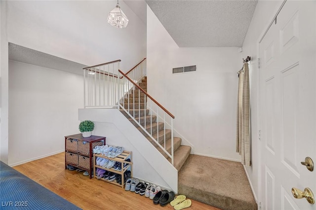 3138 White Rose Way, Henderson, NV 89014 - stairs featuring a textured ceiling and wood finished floors