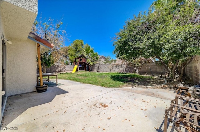 3138 White Rose Way, Henderson, NV 89014 - fenced backyard featuring a playground and a patio area