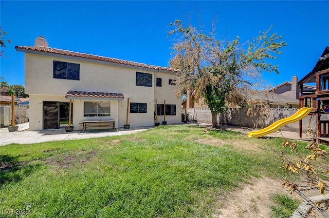 3138 White Rose Way, Henderson, NV 89014 - back of house featuring a playground, a fenced backyard, stucco siding, and a chimney